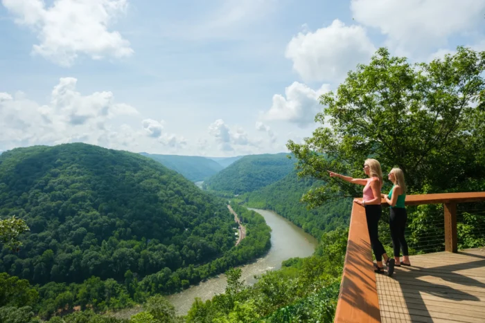 Two women standing at the Concho Rim overlook