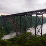 The New River Gorge Bridge spanning across the lush green gorge.
