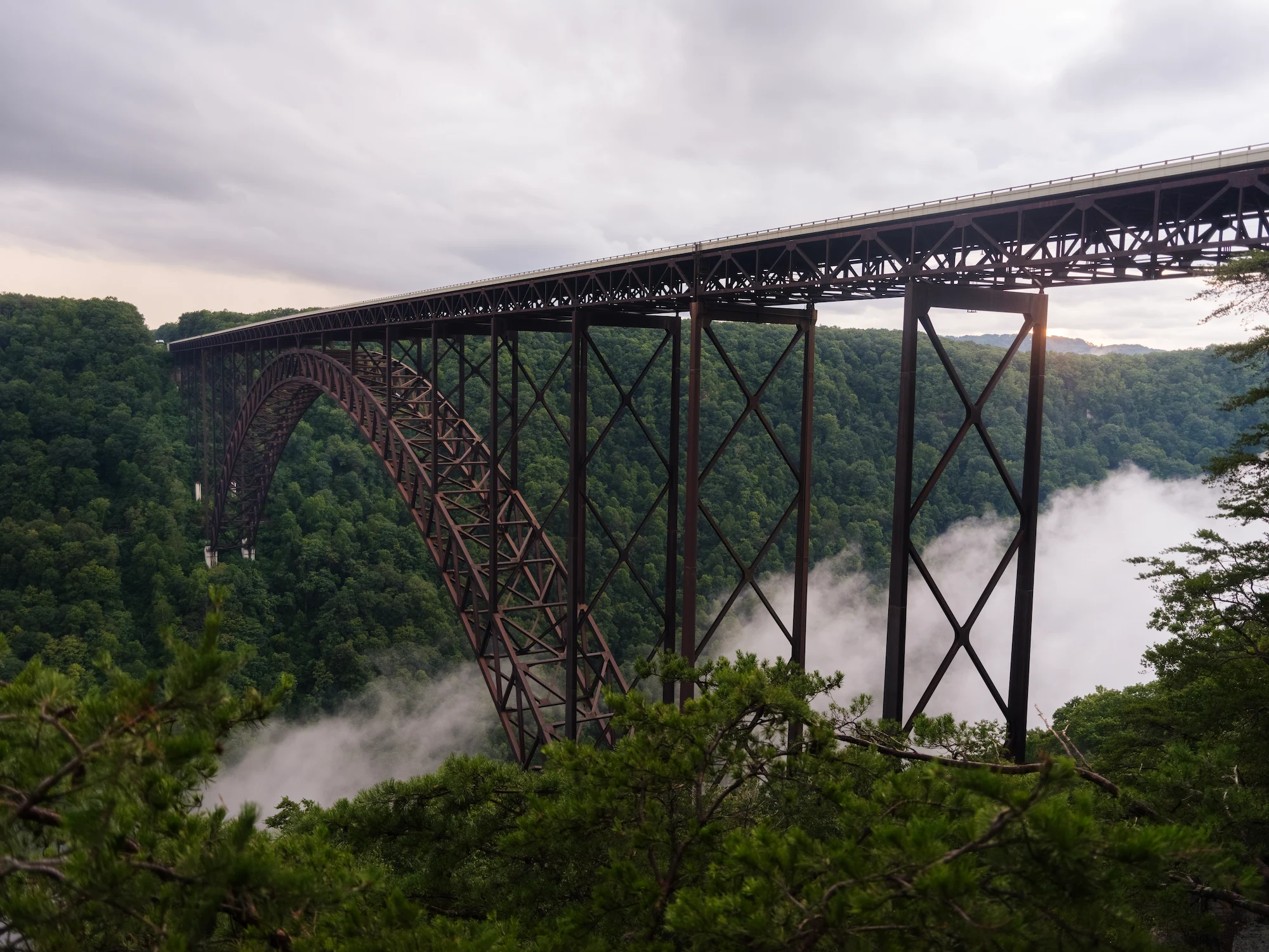 The New River Gorge Bridge spanning across the lush green gorge.